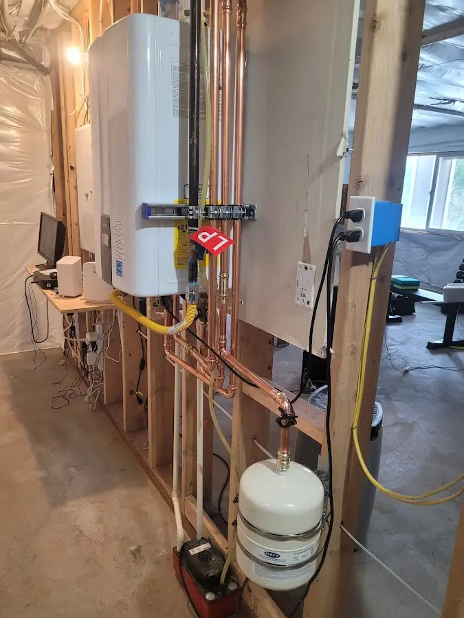 Licensed plumber repairing a kitchen sink in Lindstrom