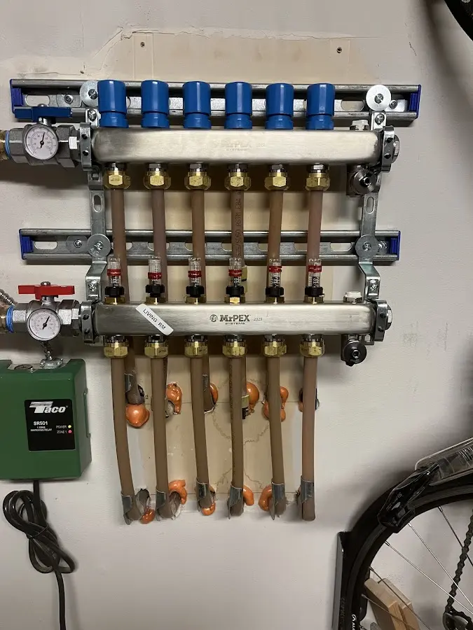 Plumber performing Water Heater Repair at a residential property in Lindstrom